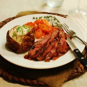 Three Pepper Flank Steak with Red Onions