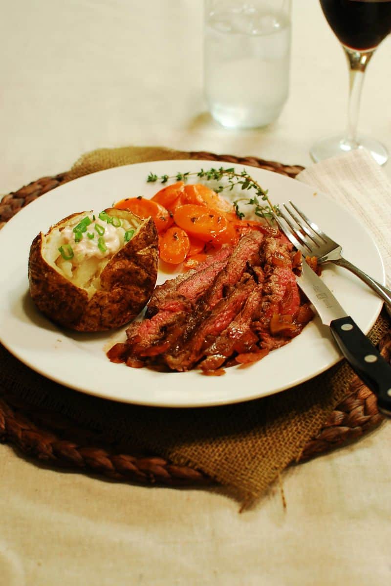 Three Pepper Flank Steak with Red Onions