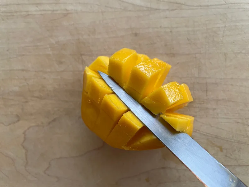 removing cubed mango