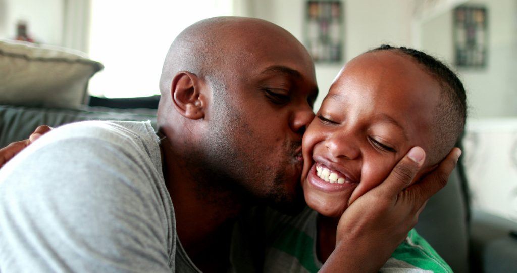 dad kissing kid: what dads want for father's day