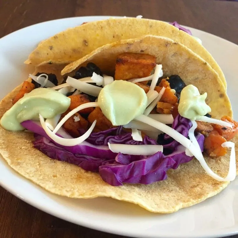 Black Bean and Sweet Potato Tacos with Avocado Crema