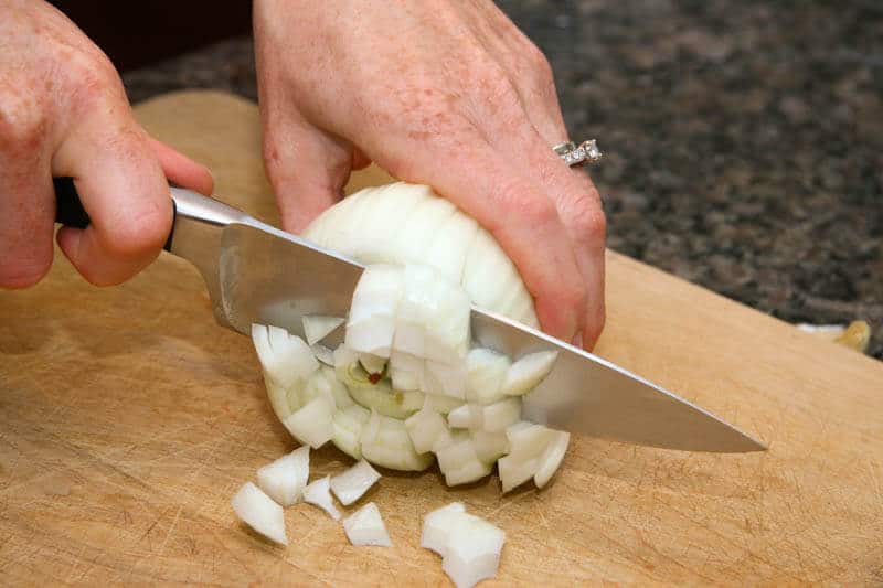 Chopping an onion. One example of how regular cooking makes you a better cook. 