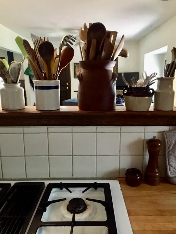 Keeping cooking utensils near the stove is helpful for kitchen organization for efficient cooking.  