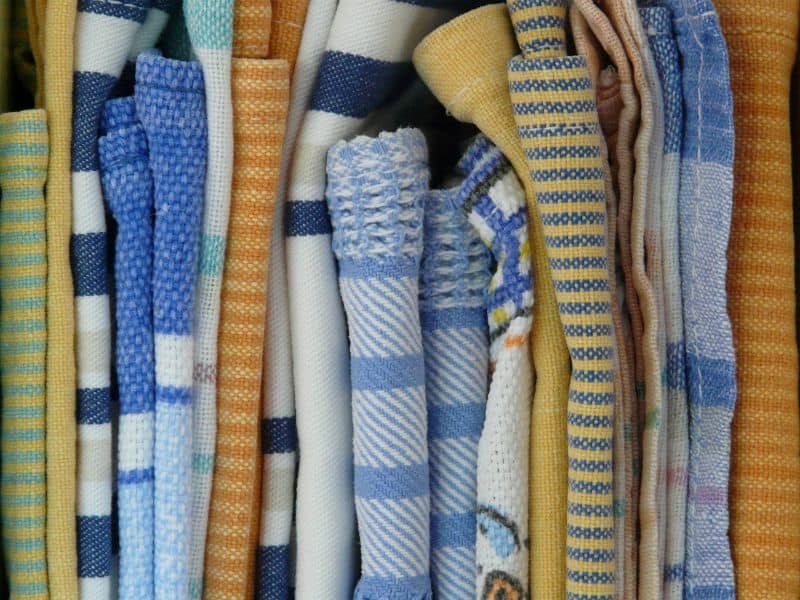 Keep lots of dishcloths on hand: an easy way to help improve your kitchen organization for efficient cooking. 