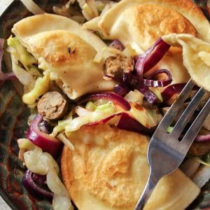 Potato and Cheese Pierogies with Sausage and Cabbage