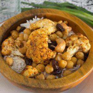 Roasted Indian Cauliflower with Chickpeas, Cashews, and Raisins