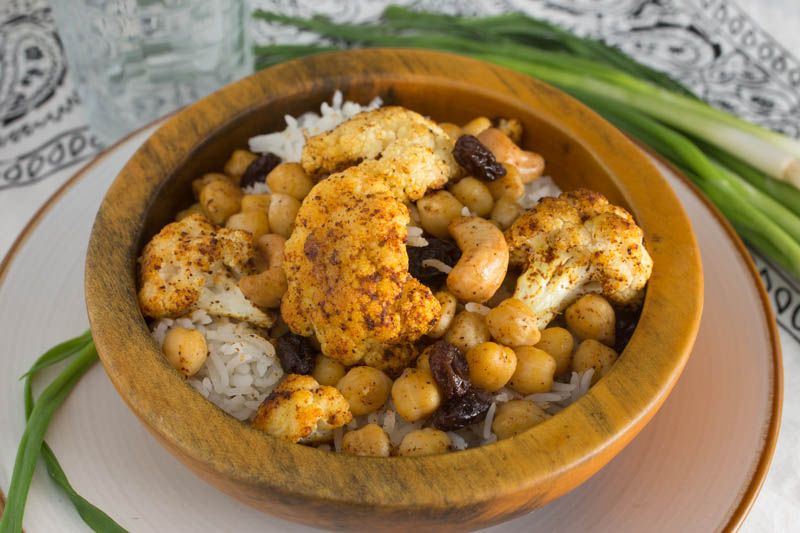 Roasted Indian Cauliflower with Chickpeas, Cashews, and Raisins