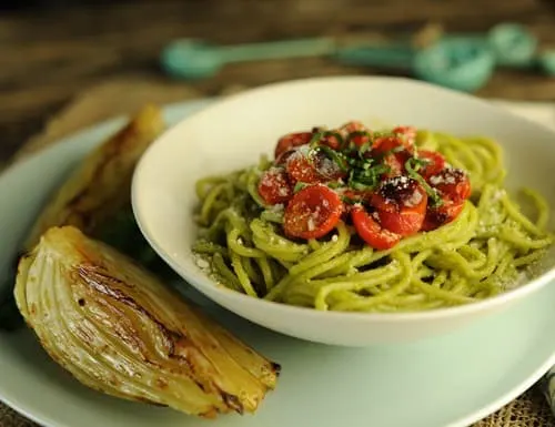 spaghetti with creamy avocado pesto and roasted tomatoes