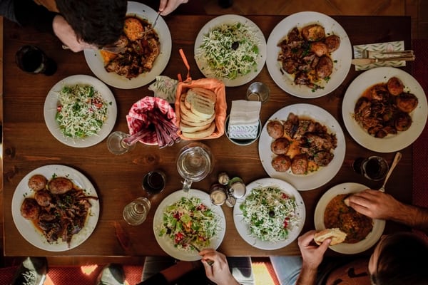 Serving dishes at family style dining