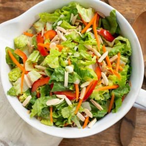 Green Salad with Red Bell Peppers, Toasted Almonds, Shredded Carrots, and Ginger Dressing