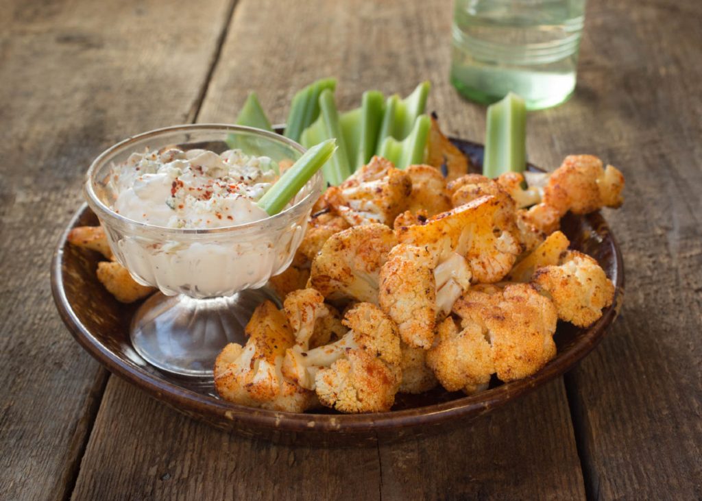 roasted cauliflower buffalo bites with blue cheese dressing