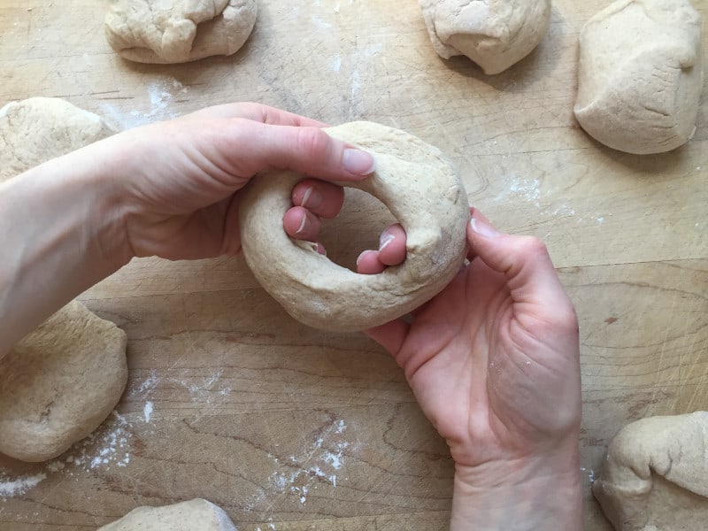 forming bagel shape with dough