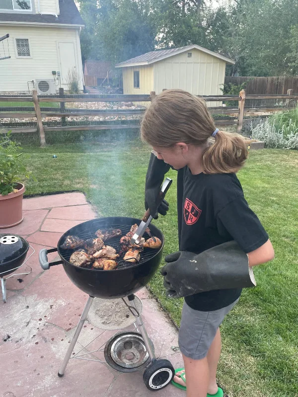 kids cooking dinner on the grill