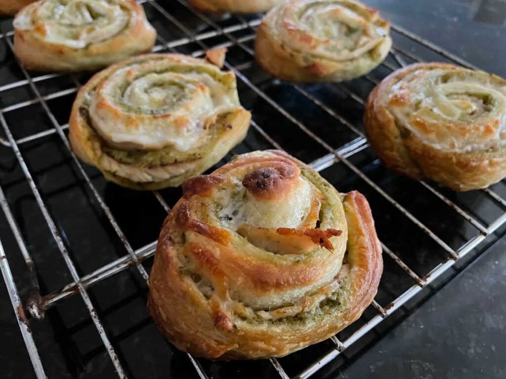 baked turkey-pesto pinwheels on cooling rack