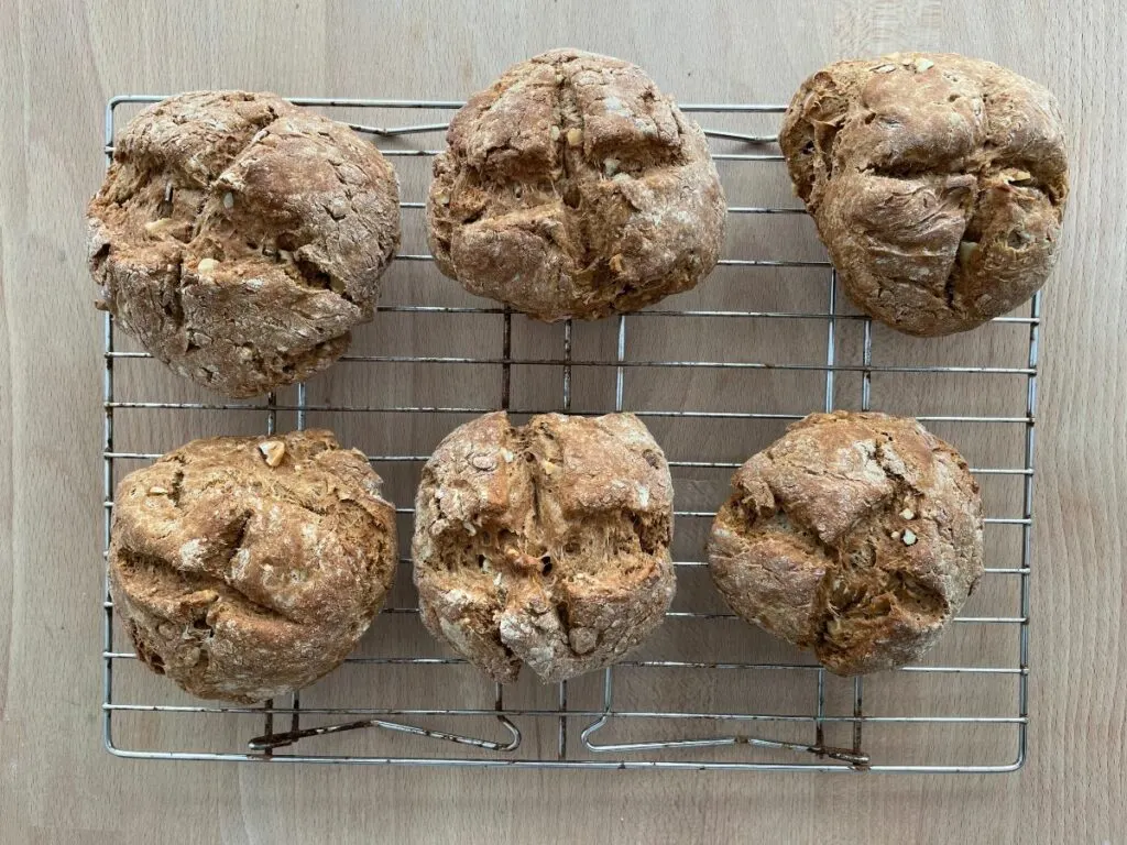 whole wheat irish soda bread rolls on cooling rack