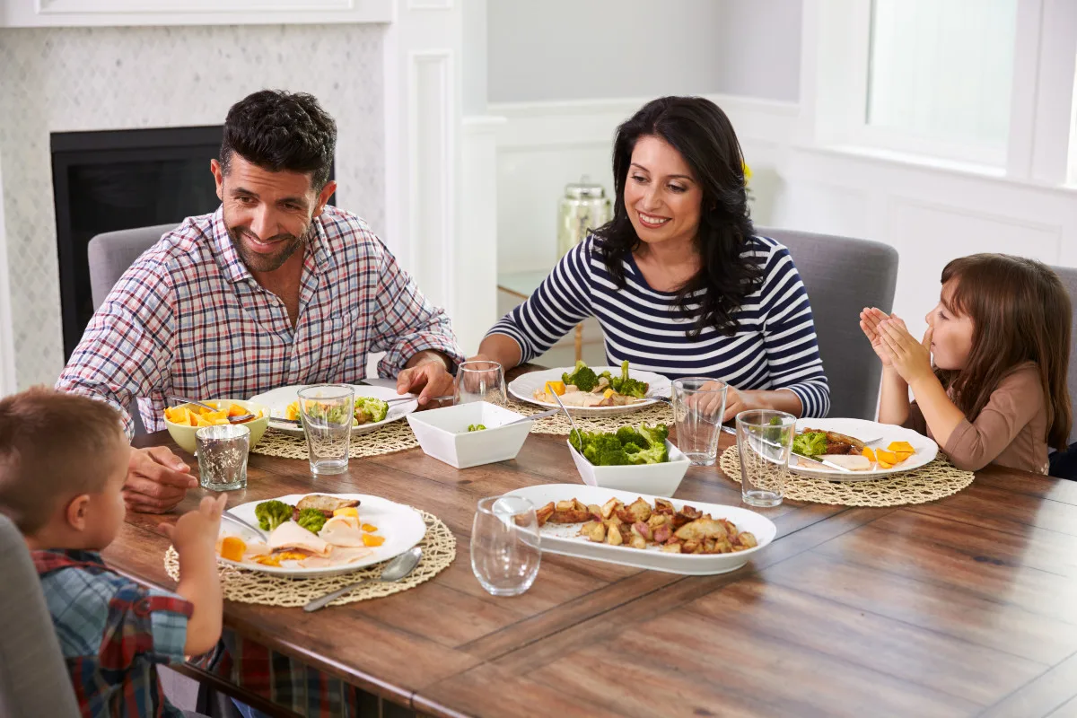 family having dinner and playing games