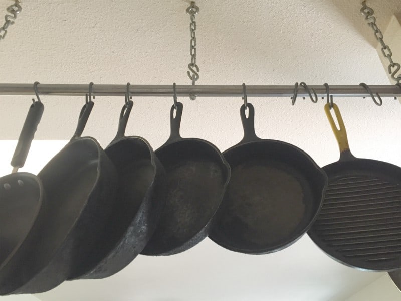 Pots and pans hanging in a well-organised home kitchen